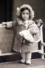 litle girl with doll